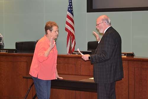 Ward 6 Council Member Jane Hill is sworn in.